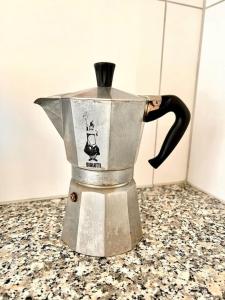 a coffee pot sitting on top of a counter at 2 Room Center Zurich Flats with Balcony - HildaB in Zurich +12 photos