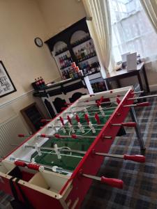 a large foosball table in a room at St. Hilary Guest House in Llandudno