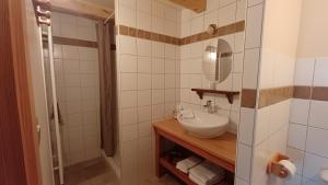 a bathroom with a sink and a mirror at La Maison de Julia in Blanzac
