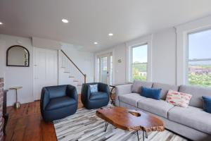 a living room with a couch and two chairs at The Rockporter in Rockport