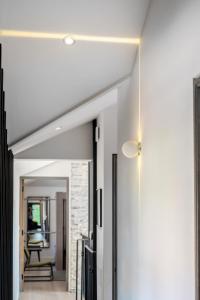 a hallway with white walls and a ceiling at The Hayloft in Strabane