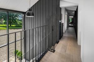a hallway of a house with a black wall at The Hayloft in Strabane
