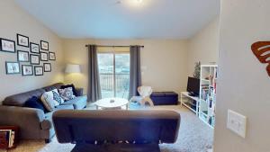a living room with a couch and a table at Red Cliff Condos #3i in Moab +22 photos