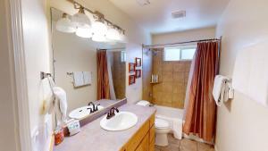 a bathroom with a sink and a toilet and a shower at Leisure Space #327 in Moab