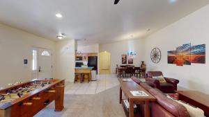 a large living room with a table and a couch at Leisure Space #327 in Moab +33 photos