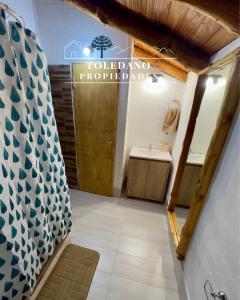 a bathroom with a toilet and a sink at Cielo Azul 4 in Villa Pehuenia +7 photos