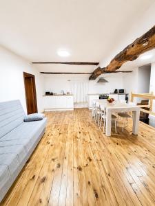 a bedroom with a bed and a table and a kitchen at Casa Portos in Lestedo