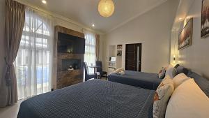 Llit o llits en una habitació de Alameda Cariari Boutique Hotel 130 fotos més