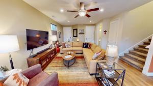 a living room with a couch and a flat screen tv at Entrada at Moab #640 in Moab