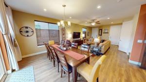 a dining room and living room with a table and chairs at Entrada at Moab #640 in Moab
