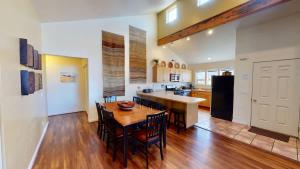 a kitchen and dining room with a table and chairs at Desert Hideaway #C2 in Moab