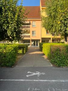 a parking lot with a pair of scissors on the road at Le Charles Quint in Gray