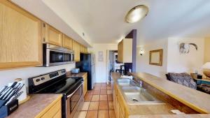 a kitchen with a sink and a stove at Sunset View #3234 in Moab