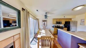a kitchen with a table and a counter top at Sunset View #3234 in Moab