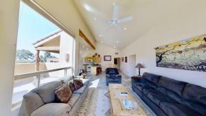 a living room with a couch and a table at Grey Pearl #Q3 in Moab