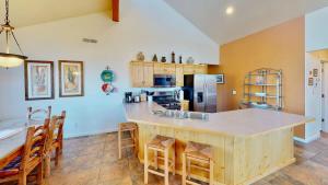 a kitchen with a large island in the middle at Arches Abode #A3 in Moab