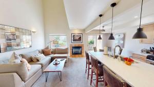 a kitchen and living room with a couch and a table at Henning's Escape #3328 in Moab