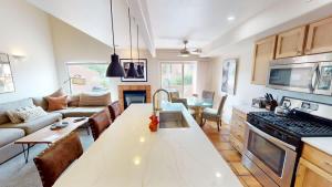 a kitchen and living room with a counter top at Henning's Escape #3328 in Moab +44 photos