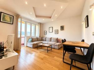 a living room with a couch and a table at Alex Apartments in Budva