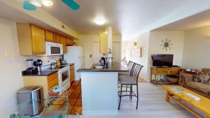 a kitchen and living room with a counter top in a room at Kokopelli Dream #3251 in Moab