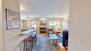 a living room with a bar and a living room at River Days #3326 in Moab