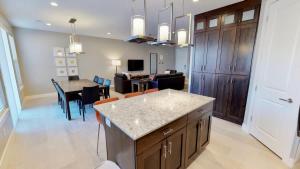 a kitchen and living room with a table and chairs at Entrada at Moab #628 in Moab +38 photos