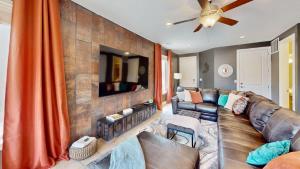 a living room with a couch and a tv at Entrada at Moab #430 in Moab