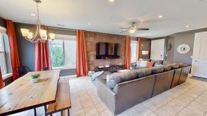 a living room with a large couch and a table at Entrada at Moab #430 in Moab