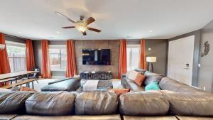 a living room with a large brown leather couch at Entrada at Moab #430 in Moab
