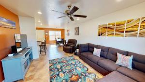 a living room with a couch and a ceiling fan at Slick Rock Reserve #12A3 in Moab