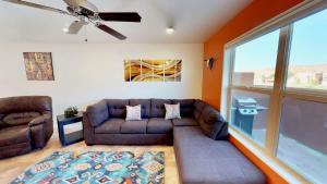 a living room with a couch and a ceiling fan at Slick Rock Reserve #12A3 in Moab