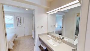 a bathroom with a sink and a large mirror at Slot Canyon #B in Moab