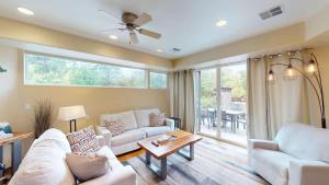 a living room with a couch and a table at Millcreek on Main in Moab