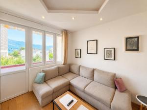 a living room with a couch and a table at Alex Apartments in Budva