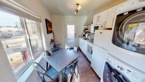 a kitchen with a table and chairs in it at Moab Flats #5 in Moab