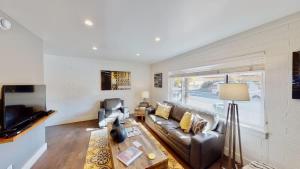 a living room with a couch and a table at Moab Flats #6 in Moab +33 photos