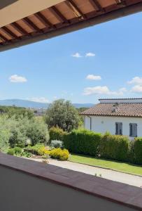 a view of a garden from the balcony of a house at Il Cerro in Arezzo