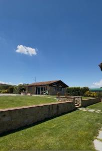 a kite flying in the sky over a house at Il Cerro in Arezzo