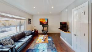 a living room with a couch and a table at Moab Flats #7 in Moab +31 photos