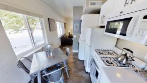a kitchen with a white stove and a sink at Moab Flats #8 in Moab +28 photos