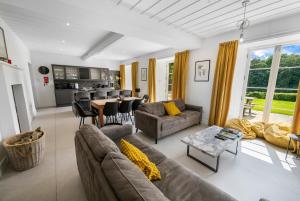 a living room with a couch and a table at Glebe House in Sion Mills