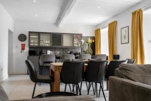 a dining room with a table and chairs at Glebe House in Sion Mills +40 photos