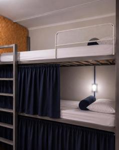 a couple of bunk beds in a room at Lulle Hostel - Congonhas - Expo - Interlagos - Morumbi in São Paulo