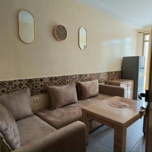 a living room with a couch and a table at Soul Surf House in Agadir