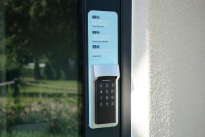 a remote control attached to the side of a window at slube am Krakower See in Krakow am See +38 photos