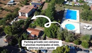 an aerial view of a house with a swimming pool at Hotel Doña Sancha in Covarrubias