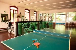 a ping pong table with two ping pong balls on it at Ville Real Hotel in Santo Antônio do Leite