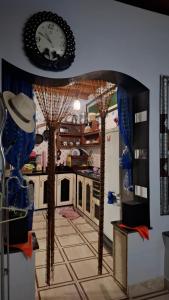 a kitchen with trees in the middle of a room at Mini-villa ajdir in Ajdir