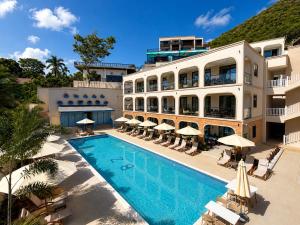 an image of a hotel with a swimming pool at Bluezone Club Residences by A'ila Resorts in Rodney Bay Village
