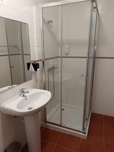 a bathroom with a sink and a shower at Casa Pires Mateus in Monsanto +48 photos
